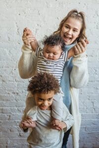 Mom happy because toddler is falling asleep at bedtime! 